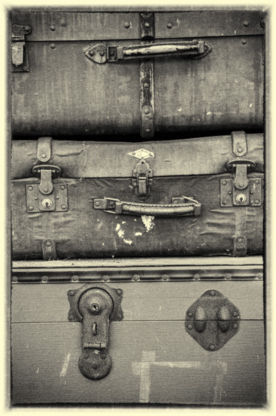 Three old suit cases.